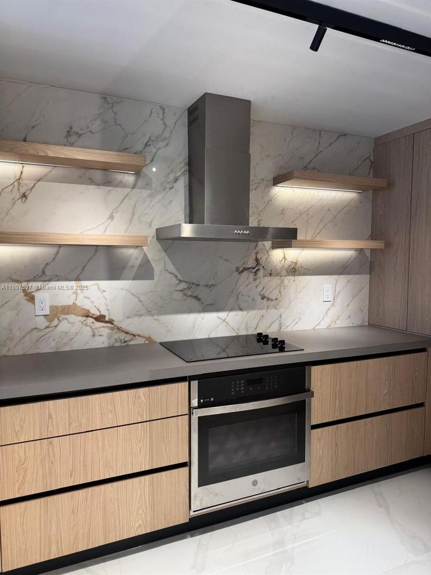 completely rebuilt and remodeled Unit. Everything is brand New.Modern design, high-end finishes, custom Kitchen, new flooring. Amazing location.