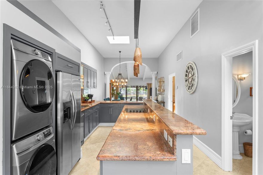 OFFERED NOW Furnished or Unfurnished. Discover this beautifully remodeled villa in the prestigious and fascinating Three Islands neighborhood, Loaded with upgrades,2 bedrooms, 2 baths + a convenient Murphy bed for guests, High vaulted cedar ceilings throughout, Impact-resistant windows for enhanced comfort, peace of mind,Washer & dryer inside unit, 2 dedicated parking spaces,  Covered terrace overlooking a tranquil lake, enjoy your own outdoors zen space. Minutes to the beach, Walmart, Publix, shops and restaurants. Casa D’Angelo ,The Capital Grille ,Chima Brazilian Steakhouse, Burlock Coast at The Ritz-Carlton, Aventura Mall, Las Olas Boulevard boutiques galleries.& Culture: Broward Center for the Performing Arts, Riverwalk Arts & Entertainment District, Seminole Hard Rock Live & Casino