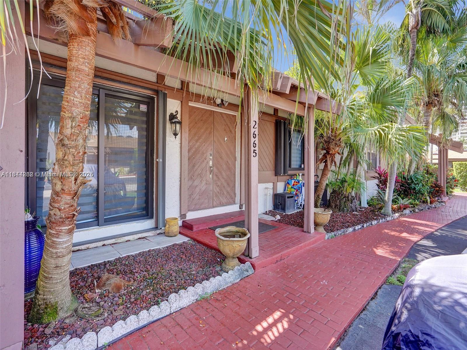 Discover this beautifully remodeled villa in the prestigious and fascinating Three Islands neighborhood, now partially furnished and loaded with upgrades,2 bedrooms, 2 baths + a convenient Murphy bed for guests, High vaulted cedar ceilings throughout, Impact-resistant windows for enhanced comfort and peace of mind,Washer & dryer inside the unit, 2 dedicated parking spaces, Covered terrace overlooking a tranquil lake, enjoy your own outdoors zen space.
Minutes to the beach, Walmart, Publix, shops and restaurants. Casa D’Angelo ,The Capital Grille ,Chima Brazilian Steakhouse, Burlock Coast at The Ritz-Carlton, Aventura Mall, Las Olas Boulevard boutiques galleries.& Culture: Broward Center for the Performing Arts, Riverwalk Arts & Entertainment District , Seminole Hard Rock Live & Casino
