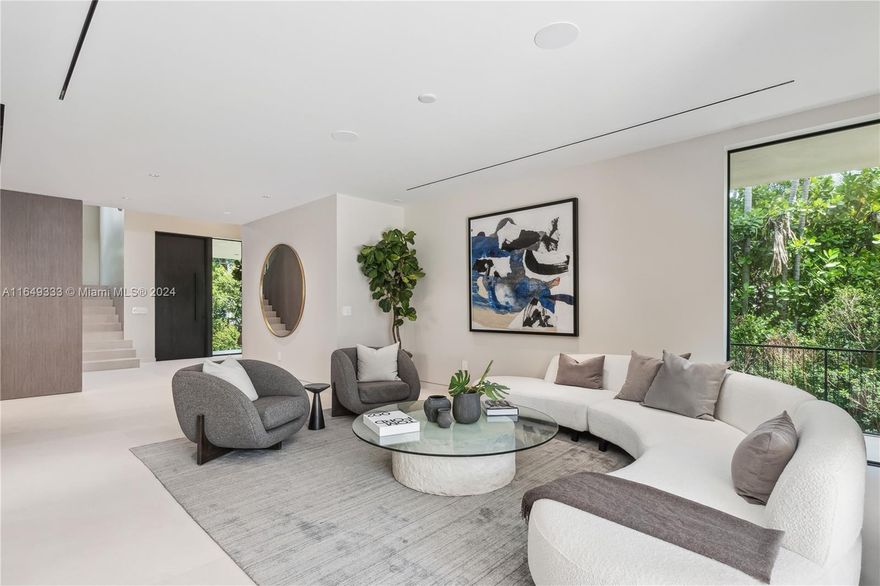 Located in the prestigious Venetian Islands in Miami Beach, this stunning modern-design home features 5 bedrooms, 5.5 bathrooms, under 3,600 SF of luxurious living space. This gated residence boasts custom-made wood panels, a formal living and dining area that opens to a rear terrace and pool. The open-concept kitchen is adorned with top-of-the-line appliances and custom cabinetry and it seamlessly connects to an informal living room. The contemporary design is further enhanced by elegant limestone and wood flooring throughout. Schedule a private viewing now to make this stunning new construction home yours!