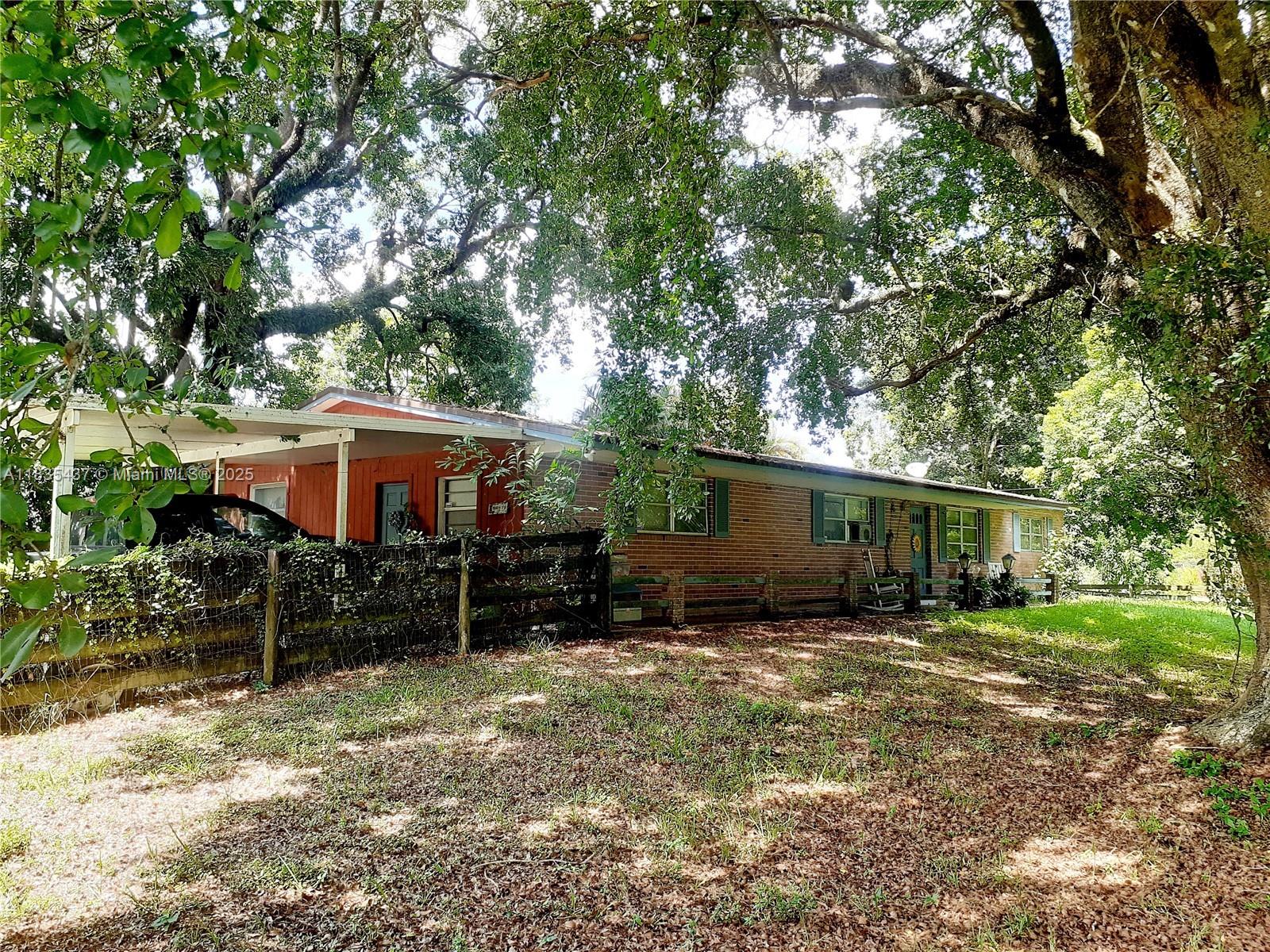 Discover a rare opportunity to own 1.61 acres in the desirable Oak Hill area. This Davie ranch property features two separate folio numbers (5040-15-01-0387, 5040-15-01-0384) and includes a single-family home along with a spacious barn. The home offers 3 bedrooms and 2 bathrooms, a family room, a living room/dining room, and a large screened-in patio. Recent updates feature an updated kitchen with soft-close cabinets, a double pantry, a new roof (2018) and a newer air conditioning unit.
The large barn is equipped with four stalls and a large tack room, complete with running water and electricity. This property presents abundant potential for customization and is fully cross-fenced for added privacy and safety. Bring your horses and all your recreational toys—endless possibilities await!