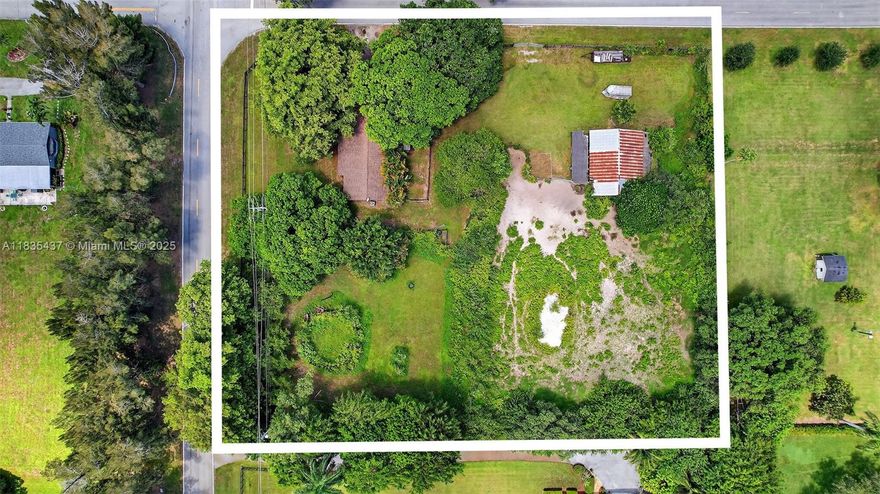 A rare opportunity to own two builder's acres on a double lot that has already been divided into separate parcels (5040-15-01-0387 and 5040-15-01-0384). Located in the desirable Oak Hill Equestrian community of Davie, this property provides direct access to Davie Trails right from your doorstep. The ranch-style home features 3 bedrooms and 2 bathrooms.

Recent updates include an updated kitchen, a new roof (installed in 2018), and a newer air conditioning unit.

Additionally, the property boasts a barn equipped with four stalls and a spacious tack room, complete with running water and electricity. This space offers abundant potential for customization and is fully cross-fenced for added privacy and safety. Bring your horses and all your recreational toys; endless possibilities await!