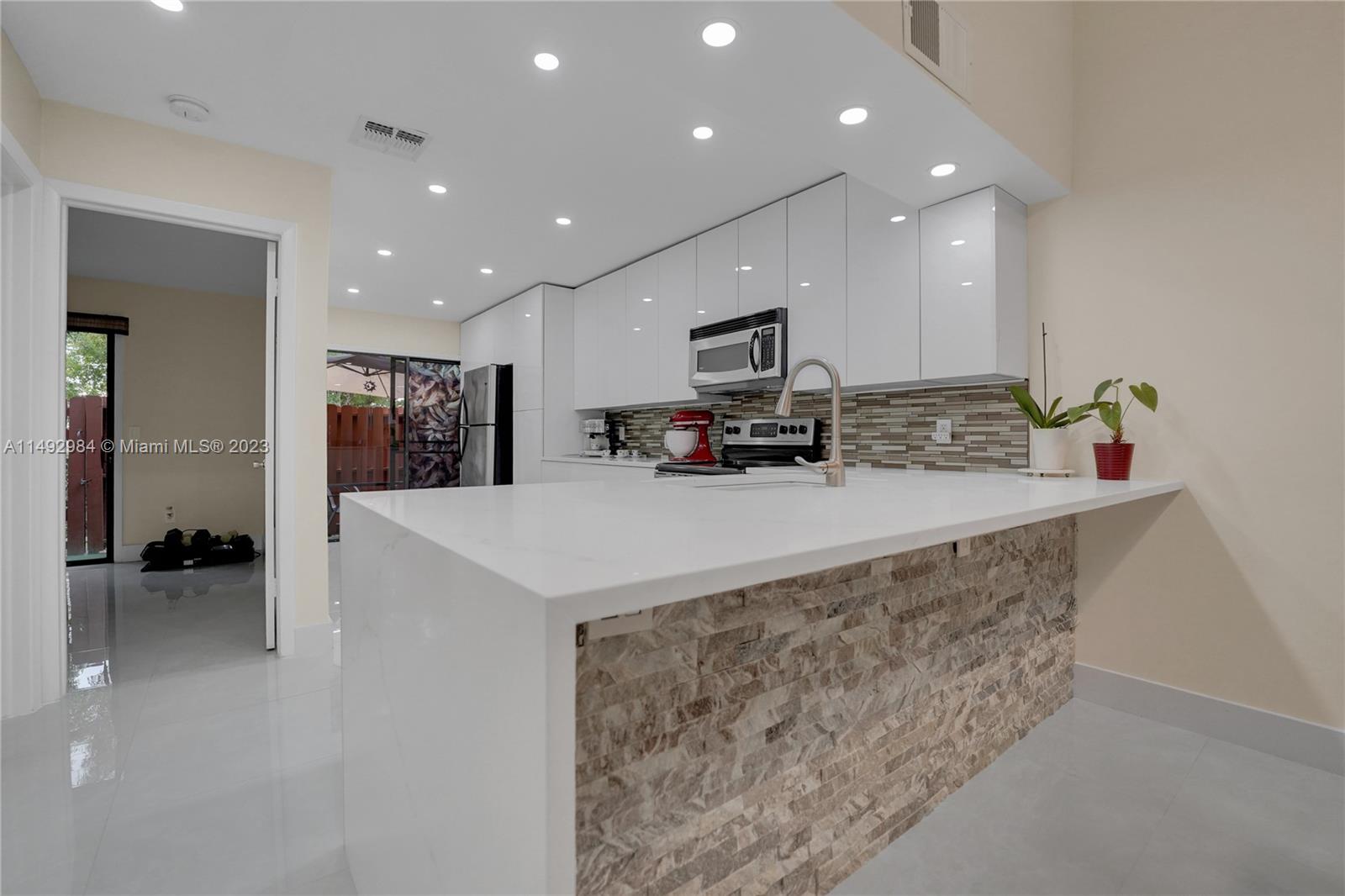 Fully renovated townhouse just steps from the beach, 2 beds, 2 baths, a new kitchen, and elegant updates throughout, this home offers a sophisticated living experience. The open-concept layout, ample natural light, and stylish flooring create a modern feel. The bathrooms feature exquisite tile work and premium finishes for a spa-like retreat. Located in a peaceful neighborhood, this townhouse provides a serene coastal lifestyle with easy access lots of shops, dinning and about a mile from the beach. Don't miss the chance to make this fully renovated beach townhouse your dream home.