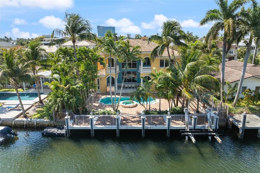 Priced to sell!  Custom 4 BR/4.5 BA waterfront residence with pool is located on 75' of deepwater and on one of the neighborhood's finest streets.  The dock features a 15,000 lb. boat lift and enjoy fast and easy access with no fixed bridges to Port Everglades Inlet.  The residence features a grand double height living room plus dining room, family room, open kitchen, custom marble flooring throughout, a four sided custom fireplace, lower level guest suite or captain's/staff quarters with private entrance, covered patio with built in BBQ, updated pool/spa, 2 new A/C units and more.  The upper level features 2 bedrooms with en-suite baths and a grand primary suite with spa bath, dual closets and office.  Close proximity to yacht club, restaurants, beach clubs, Las Olas/Downtown, airport, cruise port and all major roads.