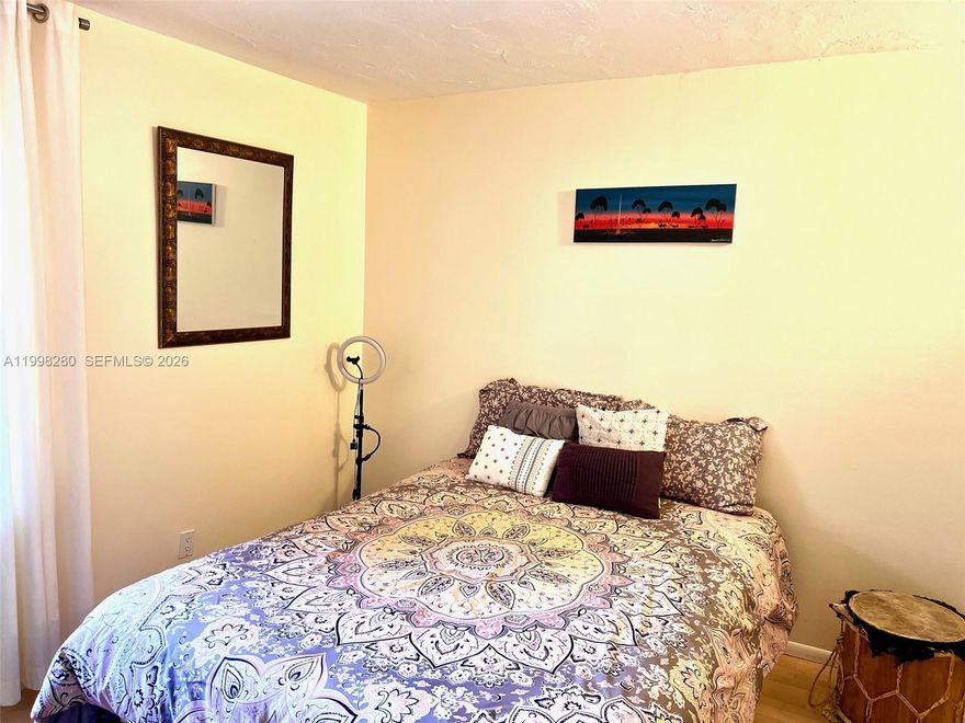 Updated and partially furnished 2/2 condo with a bright open layout and a comfortable second-floor location. The living and dining areas include fine, tasteful furniture, along with stylish curtains and full blackouts that enhance comfort and privacy. The interior features modern finishes, a clean presentation, and a move-in-ready feel. The community offers maintained common areas, a pool, and convenient access to nearby shopping, medical facilities, and major roadways. This home provides quality, convenience, and an elevated living experience.