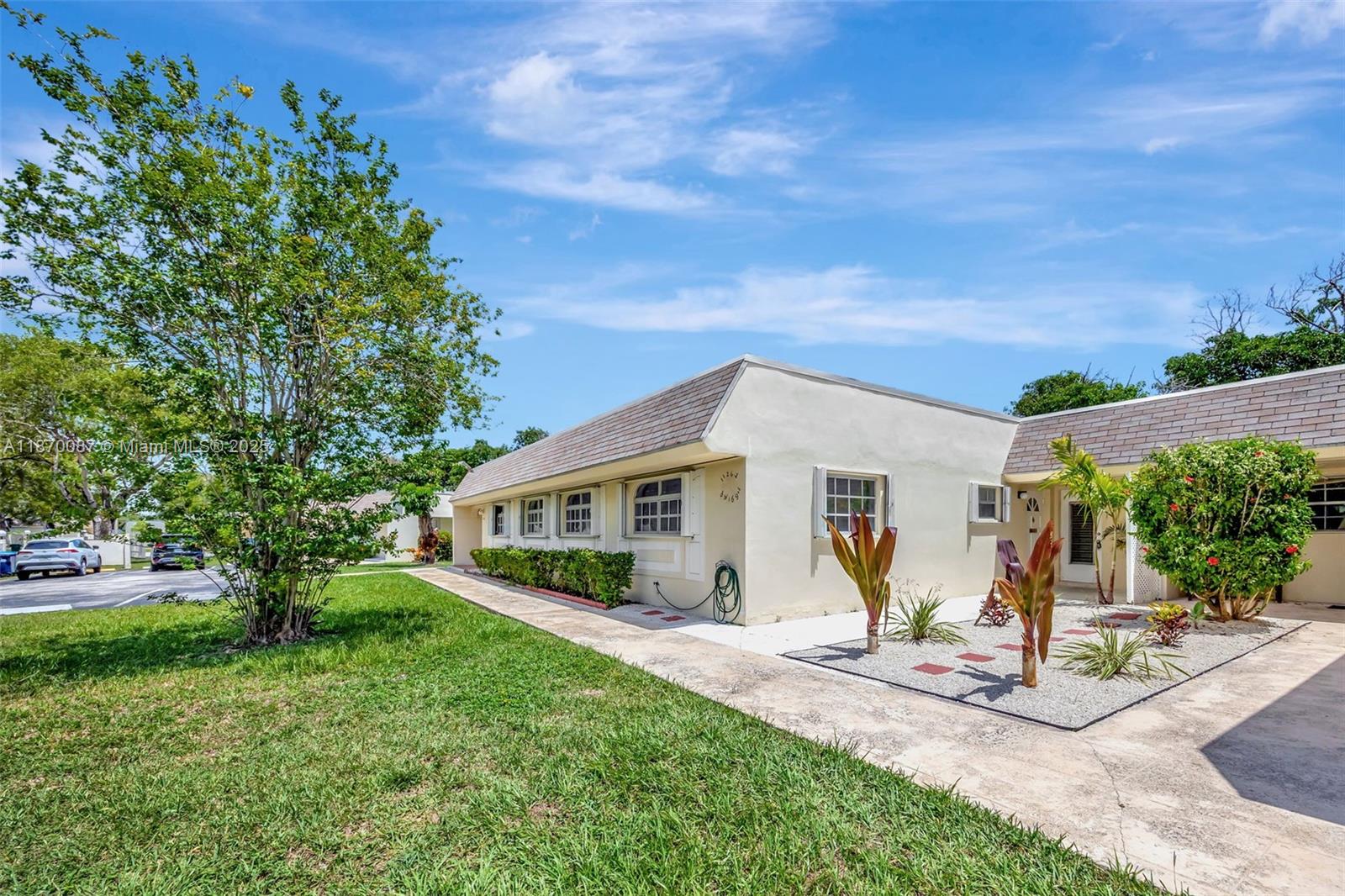 Welcome to this light, bright, and airy 2-bed, 2-bath villa-condo in the 55+ community of Green Hills Park West. The home features charming Mexican tile flooring throughout, recessed lighting, and a spacious layout. Enjoy cooking in the kitchen with a brand-new stove, plus the convenience of a new washer and dryer. Accordion shutters add peace of mind. The active community offers a clubhouse, pool, gym, social and game rooms, billiards, library, tennis, and shuffleboard. Conveniently located near the FL Turnpike, Miami Zoo, and The Falls. Move right in and start enjoying the lifestyle today—schedule your private showing!