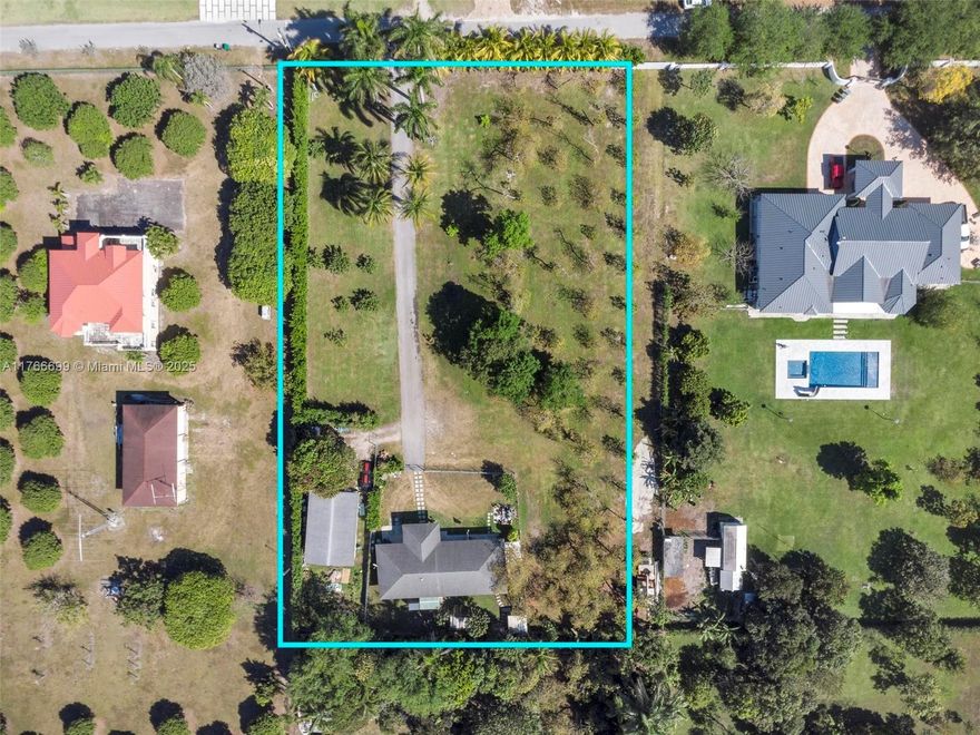 Rare opportunity to own a unique 1 bed, 1 bath home on a sprawling 60,984 sqft lot (~1.4 acres) in a prime location surrounded by multi-million-dollar estates! The 2,613 sqft structure (1,638 sqft under A/C) is positioned towards the back of the lot, offering privacy and endless potential. Enclose the expansive terrace to easily convert it into a 3/2, or use it as a guest house while building your dream home in the center of the nearly 1.5-acre property. Zoned agricultural but allows residential construction, making it perfect for those seeking space, seclusion, and opportunity. Enjoy a variety of producing fruit trees, a tranquil setting, and the convenience of being just minutes from town. A rare find—don’t miss out!