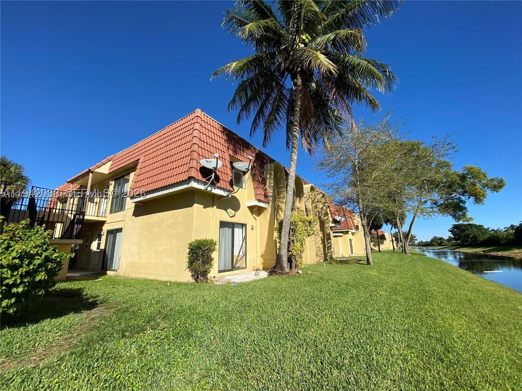 Photo of 11398 Royal Palm Blvd #11398, Coral Springs, FL 33065 (MLS # A11942033)