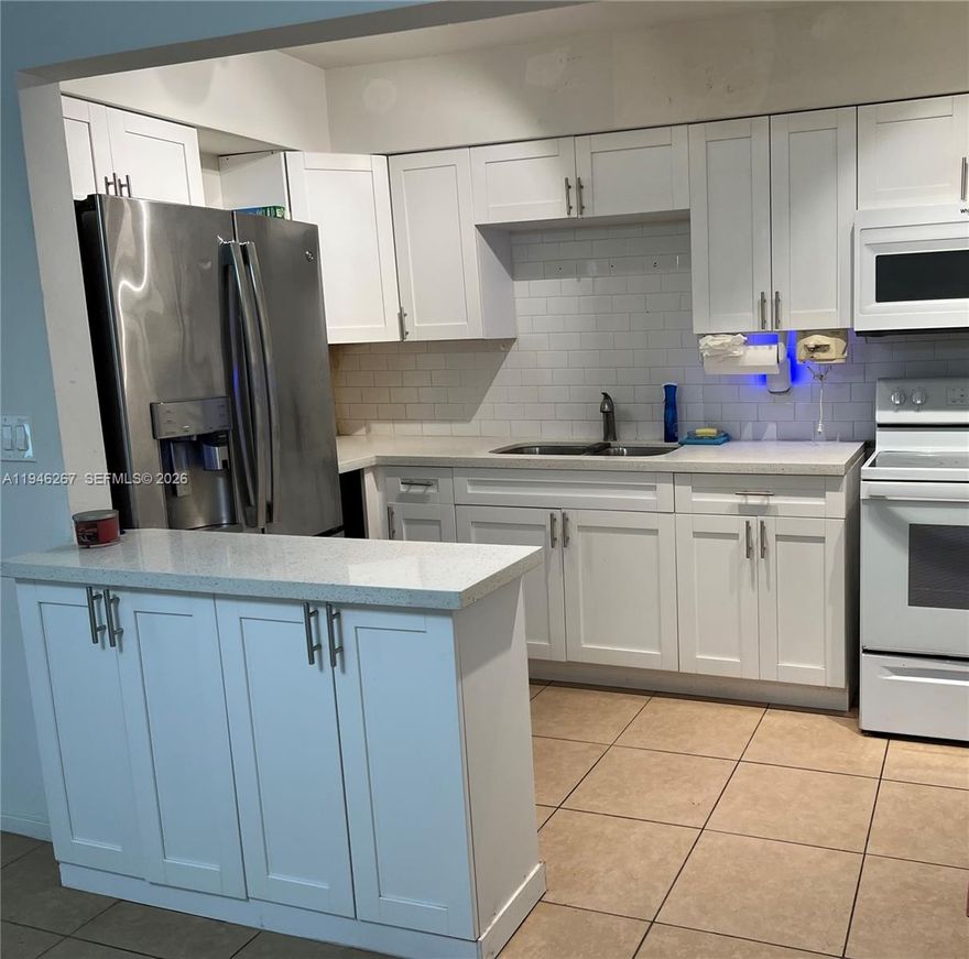 Welcome to this charming, South Florida co-op with 2 bedrooms and 1 bath nestled in a quiet, well-maintained community.  This desirable corner unit offers abundant natural light and extra privacy, creating a light and airy retreat you'll love coming home to.  Enjoy your morning coffee on the screened-in patio in back or chat with your neighbors on your front porch as the afternoon turns to evening.  Perfect for year-round living or as a winter retreat from the cold with low carrying costs.  You will be close to beaches, airports, shopping, dining, sports (golf, major league venues) and the Hard Rock Casino.  New roof (2023), central air, laundry facilities in the same building, and abundant storage in a partially updated unit.