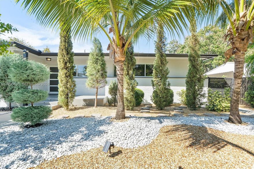 Fully upgraded residence ideally located steps from Miami’s Design District, offering the perfect blend of privacy, style, and prime urban access. This beautifully remodeled home features a new pool, full-home generator, security system and extensive landscaping with hundreds of mature trees, creating a lush, private oasis in the heart of the city.
The property showcases a bright, modern aesthetic with a 3 yr old roof and clean architectural lines. Outdoor spaces are designed for both relaxation and entertaining, with an expanded concrete driveway and a functional layout that maximizes comfort and usability. All improvements have been completed with permits, providing added value and peace of mind. This home places you just moments from world-class dining, luxury shopping, art galleries, and cultural hotspots—while still enjoying the tranquility of a residential setting.