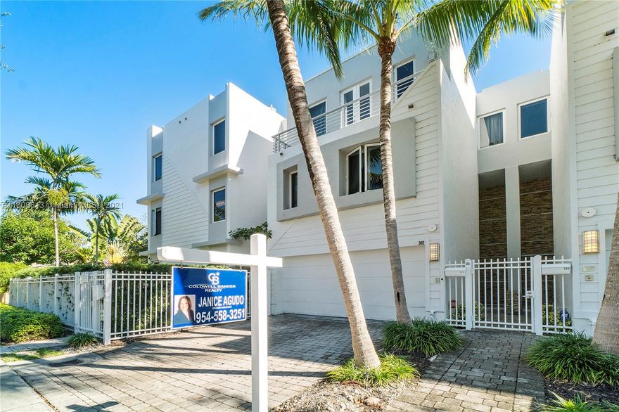 This spectacular tri-level town home has volume ceiling throughout with 3 bedrooms & 3 1/2 baths & all the upgrades.First level features the chefs kitchen with stainless appliances/European cabinets/granite countertops, a spacious great room, elevator, travertine floors throughout & paved private fenced patio.Second level offers a sunlit master suite with balcony, large walk-in closet & spa-like bathroom.Second bedroom boasts en-suite bath, lots of natural light, skylights, & walk-in closet.The top floor has a large family room, office nook & private junior master suite with balcony.The expansive outdoor sundeck terrace has great city/skyline views. Impact glass, beautiful marble floors, grand entrance, wood-plank stairs, paved driveway.Short stroll to Las Olas, markets & restaurants.