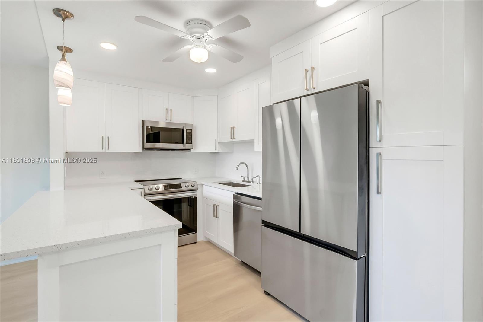 Don't miss out on this completely renovated condo in the adult 55+ community of Century Village in Boca Raton. The unit offers an ample and open floor plan with 1 bedroom, 1.5 remodeled bathrooms, a peninsula kitchen featuring beautiful countertops, modern white cabinetry and stainless steel appliances. Outdoors, enjoy the privacy of a screened-in balcony. The association offers multiple indoor and outdoor pools, clubhouse, theater and so much more. Water and cable are included.