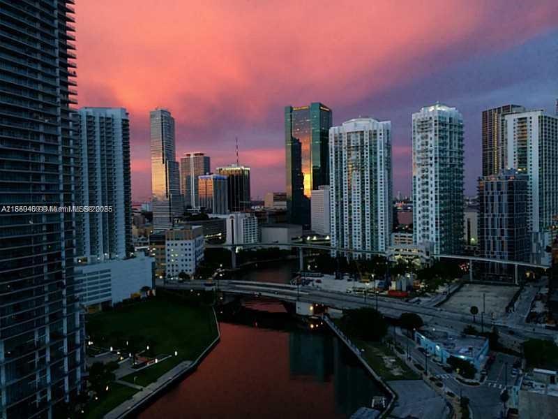 LOCATION, LOCATION, LOCATION. Neovertika is a modern and unique building, designed by architect Revuelta Vega in 2006. Located on the banks of the Miami River, steps away from City Brickell, excellent restaurants, shops, nightclubs, the Metro Mover, and the Metro Rail, imagine enjoying and admiring this fabulous view of the Miami River and the city skyline. This two-story apartment offers magnificent natural light, a 6-meter-high ceiling, loft style, two bedrooms, and two and a half bathrooms. The master bedroom has a private balcony with city views.