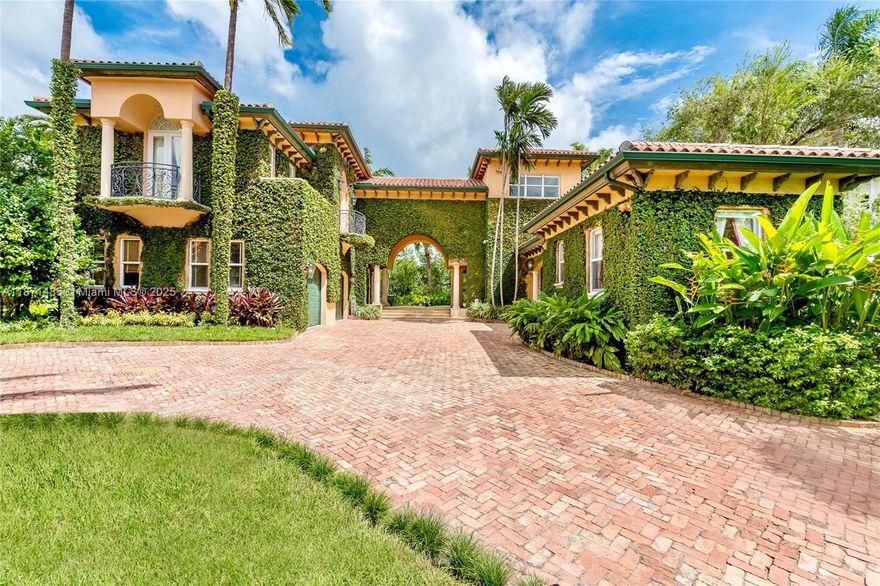 Nestled in the exclusive Islands of Cocoplum community, this stunning waterfront estate offers luxury living at its finest. Spanning 6,657 SF, the home totals 7 spacious bedrooms & 6.5 bathrooms spread between the 4 BR/3.5 BA main house, plus 2 guest houses and a separate gym/office. The 19,046 SF lot enjoys 172’ of peaceful water frontage with a private dock and 1 high bridge to the Bay. Ideal for entertaining, the home’s double-height foyer entry leads to the elegant living & dining rooms, family room that opens to a deep porch overlooking the pool, and a chef’s kitchen w/ lush garden views. The primary suite has its own balcony, dressing room, & large bathroom, & the additional bedrooms in the main & guest houses are generously sized. This is South Florida waterfront living redefined!