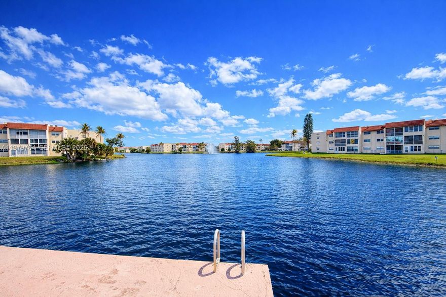 MOVE IN READY. THIS BEAUTIFUL UNIT HAS BEEN UPGRADED WITH NEW FLOORS AND NEW BATHROOMS. KITCHEN HAS TILED COUNTER TOPS WITH A STAINLESS-STEEL REFRIGERATOR. ENCLOSED FLORIDA ROOM WITH A LOVELY PANORAMIC  OF THE LAKE AND A PRESERVE.