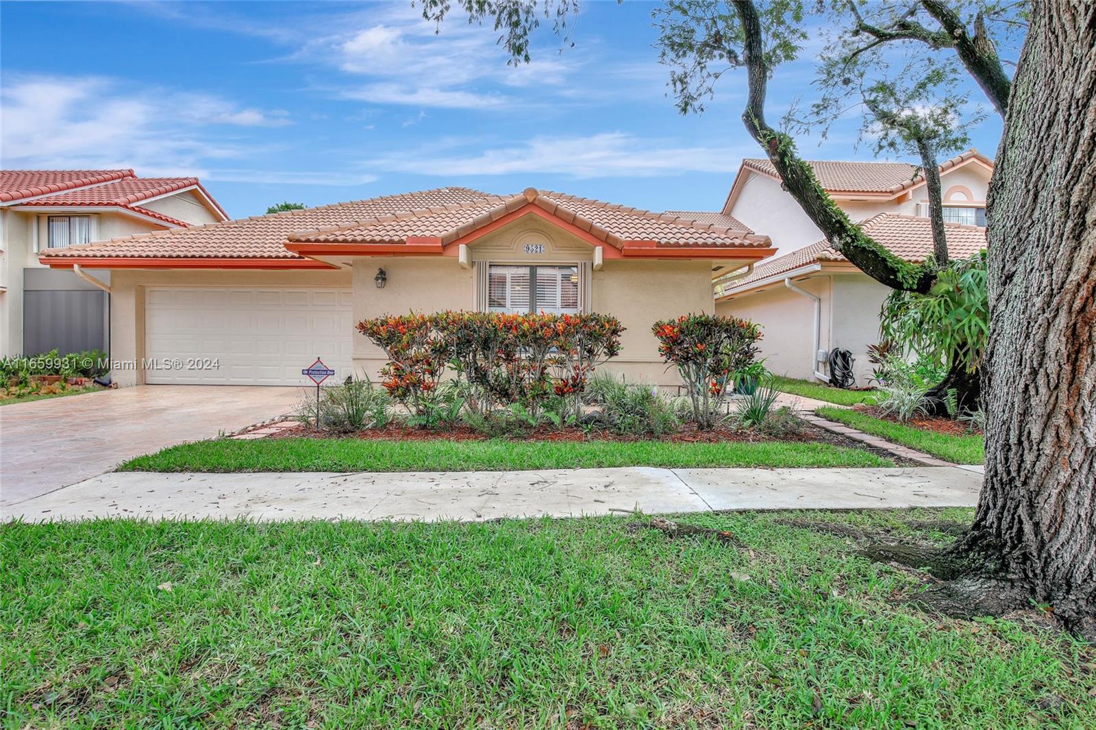 Fantastic single-story home in gated community of Mayfair @ Jacaranda! 3 bedroom 2 bath with 1952 sq ft under air & 2 car garage! Split bedroom layout w/ vaulted ceilings. Tons of natural light. Tile flooring throughout main living areas. Renovated kitchen w/ wood cabinetry, granite countertops & stainless-steel appliances. Eat in kitchen nook w/ separate formal dining room. Indoor laundry room. Recently purchased above ground jacuzzi! Great patio area with manicured landscaping, completely fenced. Accordion shutters & impact garage door. AC, Trane unit (2017). Water Heater (2020). Community features sidewalks. HOA fee covers gate, lawn cutting for front of the home & trees, gate and child's playground. Centrally located just minutes to highways, New Plantation Walk & so much more!