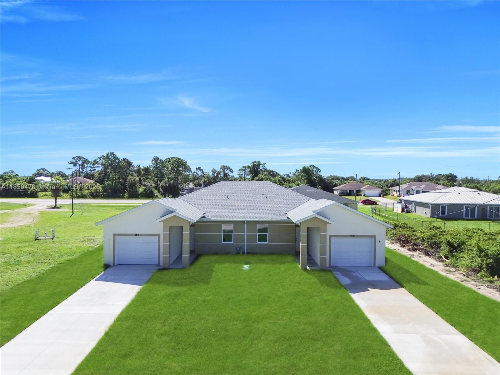 MOVE-IN READY! Motivated seller! This brand-new duplex is nearing completion and will soon be ready for occupancy in Lehigh Acres. Each unit offers 1,199 square feet with 3 bedrooms and 2 bathrooms, designed for maximum comfort and efficiency. You'll love the open-concept kitchens with sleek white cabinetry, beautiful quartz countertops, and a full array of stainless-steel appliances. For your convenience, each unit also includes laundry in the garage. This property is ideal for investors or owners looking to live in one unit and rent out the other, located in a growing area with great rental potential.