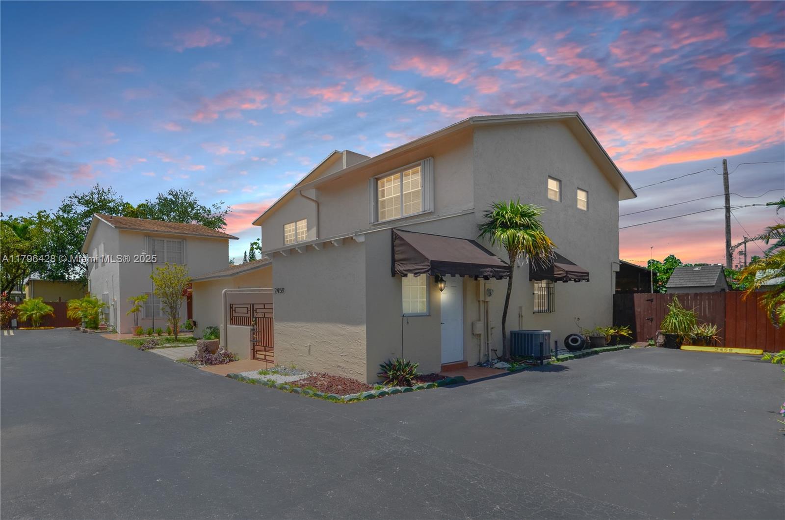 Exceptional central location in a quiet and securely gated community! This spacious 3 bedroom / 2.5 bath townhome offers comfort and convenience and features updated porcelain floors, updated kitchen with quartz countertops, wood cabinets, and snack counter. The first floor includes one large bedroom with additional entrance and a half bath for your guests. The second floor plan includes the primary bedroom suite and second large bedroom, each with their own walk-in closets, and two full bathrooms upstairs. The fully fenced backyard is perfect for enjoying Florida’s weather and features a covered terrace, dedicated laundry room, and contemporary storage shed for your convenience. Don’t let this one slip away!