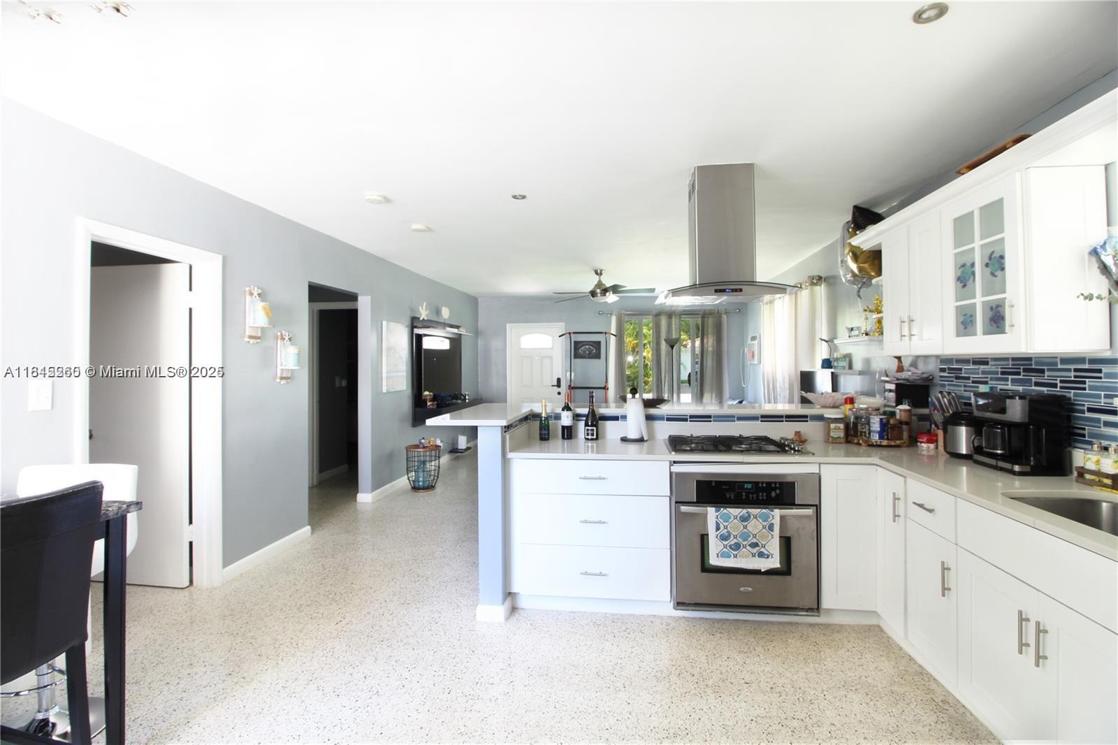 Welcome to this true east Hollywood classic! Updated one story house with guest quarters / in law suite. House can be a 3/2 or 2/1 with a studio. Studio was completely redone last year with high end finishes including full bath and kitchenette. Main house has pristine terrazzo flooring with updated kitchen and bathroom. Impact windows and doors round out this gem, only a mile from downtown Hollywood, and less than three miles to the beach. Plenty of parking in the front and back via an alley way. Can be great for short term renting or generational living.