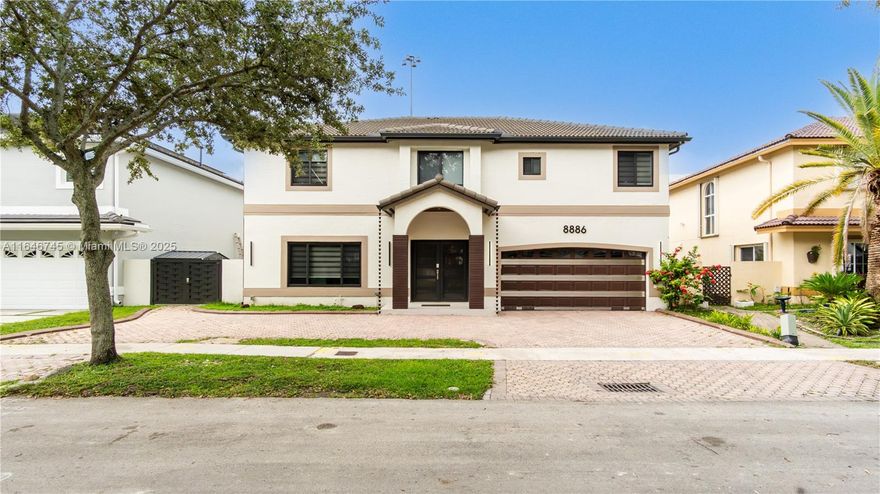 Nestled in a prestigious gated community near Miami-Dade and Broward, this stunning two-story home combines luxury with modern comfort. The open-concept interior boasts sleek tile flooring, high ceilings, and expansive windows that flood the space with natural light. The gourmet kitchen features top-tier appliances and elegant cabinetry. Upstairs, serene bedrooms include a master suite with a spa-like bath. Outside, a private oasis awaits with a sparkling pool and lush landscaping. Every detail reflects contemporary sophistication, offering the pinnacle of South Florida living.