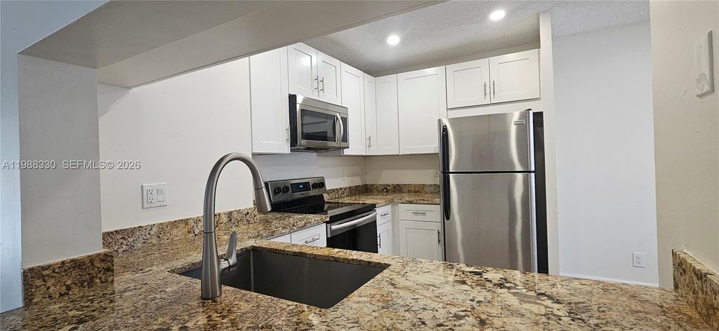 Photo of 11323 Royal Palm Blvd #D-2, Coral Springs, FL 33065 (MLS # A11988330)