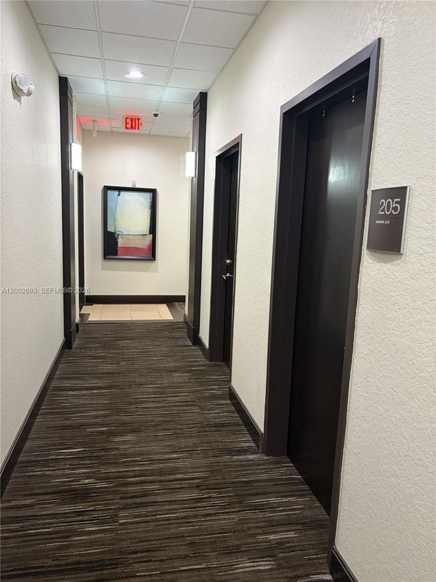 650 SF professional office suite in a well-maintained building in Pembroke Pines. Unit 205 features 2 private offices (approx. 120–150 SF each), open workstation area for 3 desks, reception area, and kitchenette. Bathrooms located on the same floor just outside the unit. Ideal for small professional users seeking efficient layout and turnkey functionality. Elevator building with convenient access.