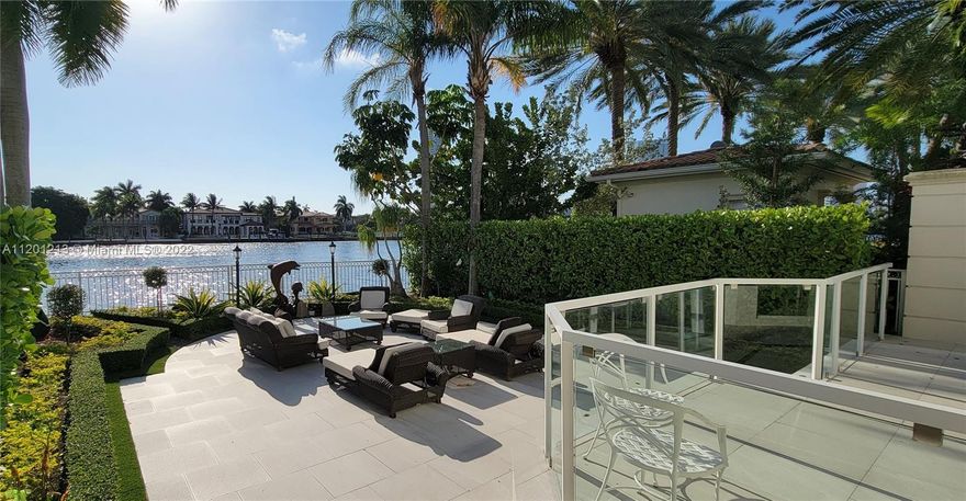 PORTO VITA - NEWLY REMODELED by Jeff Howard Design Group, this contemporary styled 2 story, 3 Bedroom + Office +Den and 4 and 1/2 baths corner waterfront Townhouse is chic and refined. Impeccable neutral palette featuring italian porcelain and wood floors, light colored venetian stucco walls, volume ceilings with skylights, brand new kitchen cabinetry with Miele appliances, brand new high impact windows and doors, smart home system & lighting, and an interior elevator. Outdoor space with seating areas for entertaining include a Bar-B-Q Grill & spectacular waterfront views across the intracoastal to Golden Beach. A 2 car enclosed garage is a car lovers dream with lots of storage,additional parking for 2 cars in drive way. Secure gated community with Spa, Restaurants, Tennis, and much more!