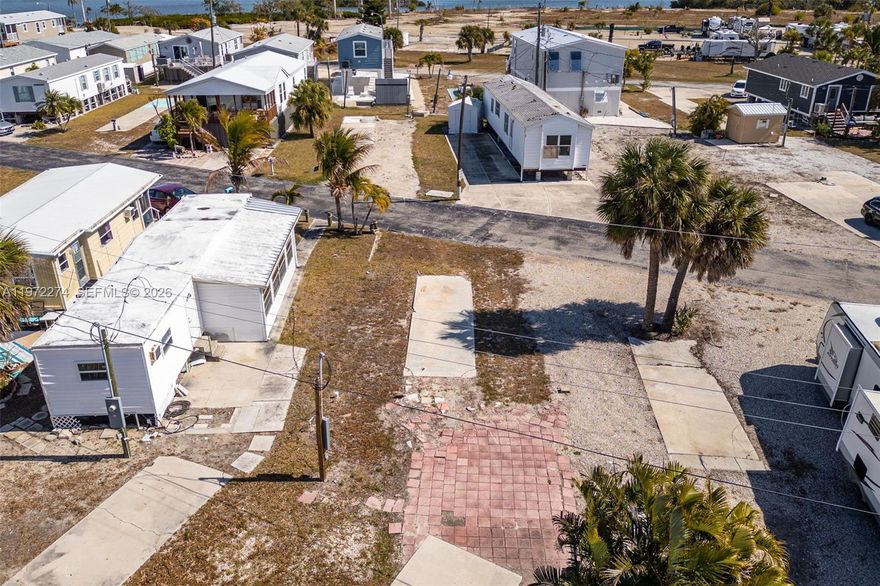 Perfectly positioned to enjoy the very best of Fort Myers Beach living, this beautiful lot is just over one mile from Times Square and the area’s pristine white sand beaches. Spend your days biking to the beach, strolling to waterfront dining at Doc Ford’s Rum Bar & Grille or Dixie Fish Co., or exploring the nearby shops and entertainment, all while coming home to a peaceful, tucked-away setting on charming San Carlos Island. You’re also within walking distance to Parrot Key Caribbean Grill and Salty Sam’s Waterfront Adventures, as well as the Key West Express, making spontaneous island getaways effortless. Located within the intimate 55+ Helen Lane Condo Community, this property offers the opportunity to design and create your own dream haven for a manufactured home. Enjoy the balance of being close to the action without the constant noise, giving you the best of both worlds. Pet-friendly and golf cart-friendly, this is island living made easy. Opportunities to own in this special slice of Fort Myers Beach don’t come around often. Whether you’re searching for the perfect seasonal retreat or a full-time piece of paradise, this is your chance to make it a reality.