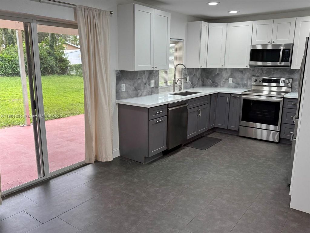 Photo of 1020 NW 45th Ct, Fort Lauderdale, FL 33309 (MLS # A11881234)