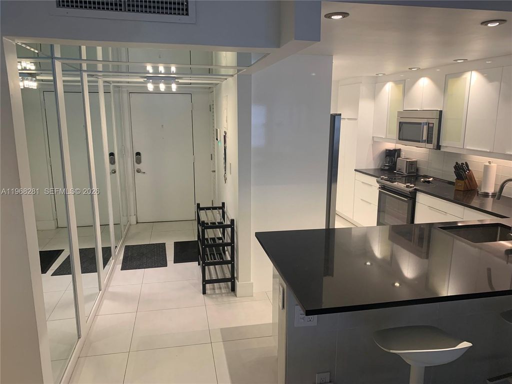 Photo of 2326 S Cypress Bend Dr #221, Pompano Beach, FL 33069 (MLS # A11968281)