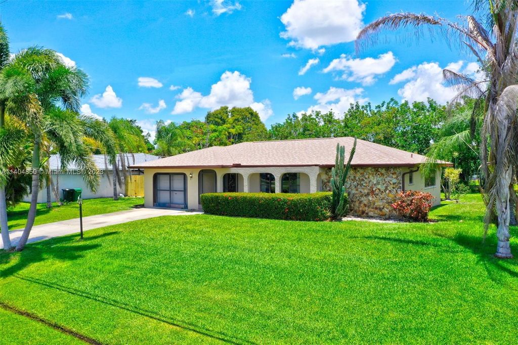 Photo of 707 SE Chaloupe Ave, Port Saint Lucie, FL 34983 (MLS # A11404850)