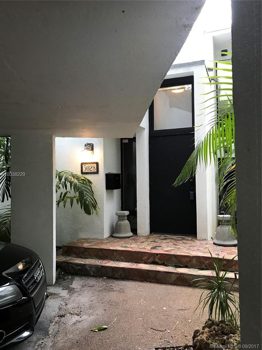 This beautiful 2/2 townhouse villa both shrouds you in tropical seclusion within Lemontree Village; yet has you  minutes away from the central social scene in highly desired Coconut Grove.  This lovely home has had substantial updates - kitchen includes stainless steel appliances, granite counters, an abundance of soft-closing cabinets; both bathrooms have new everything! Ample-sized bedrooms are split with Master upstairs; guest downstairs. Master contains custom closets and a private nook - perfect for small office or reading area. Wood and tile flooring throughout. A walled back patio allows for privacy while enjoying in solitude or entertaining with loved ones.  Community pool; gated.  Minutes away from fantastic dining and shopping. Professional photos and video coming soon!