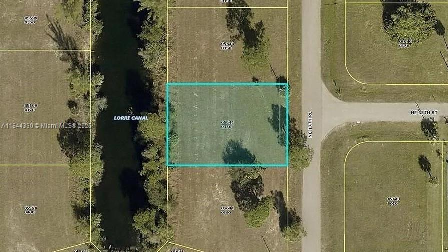 Discover this fantastic single-family vacant lot with freshwater canal access on the Lorri Canal in beautiful NE Cape Coral, right in the sought-after Gator Circle area. Launch your canoe or kayak right from your backyard and explore Cape Coral’s scenic canal network at your leisure. This neighborhood offers convenient access to shopping, dining, and endless entertainment options. Located near Island Coast High School and Del Prado Blvd N., this lot combines peaceful waterfront living with everyday convenience. Drive by and see where your dream home could soon be built—this opportunity won’t last long!