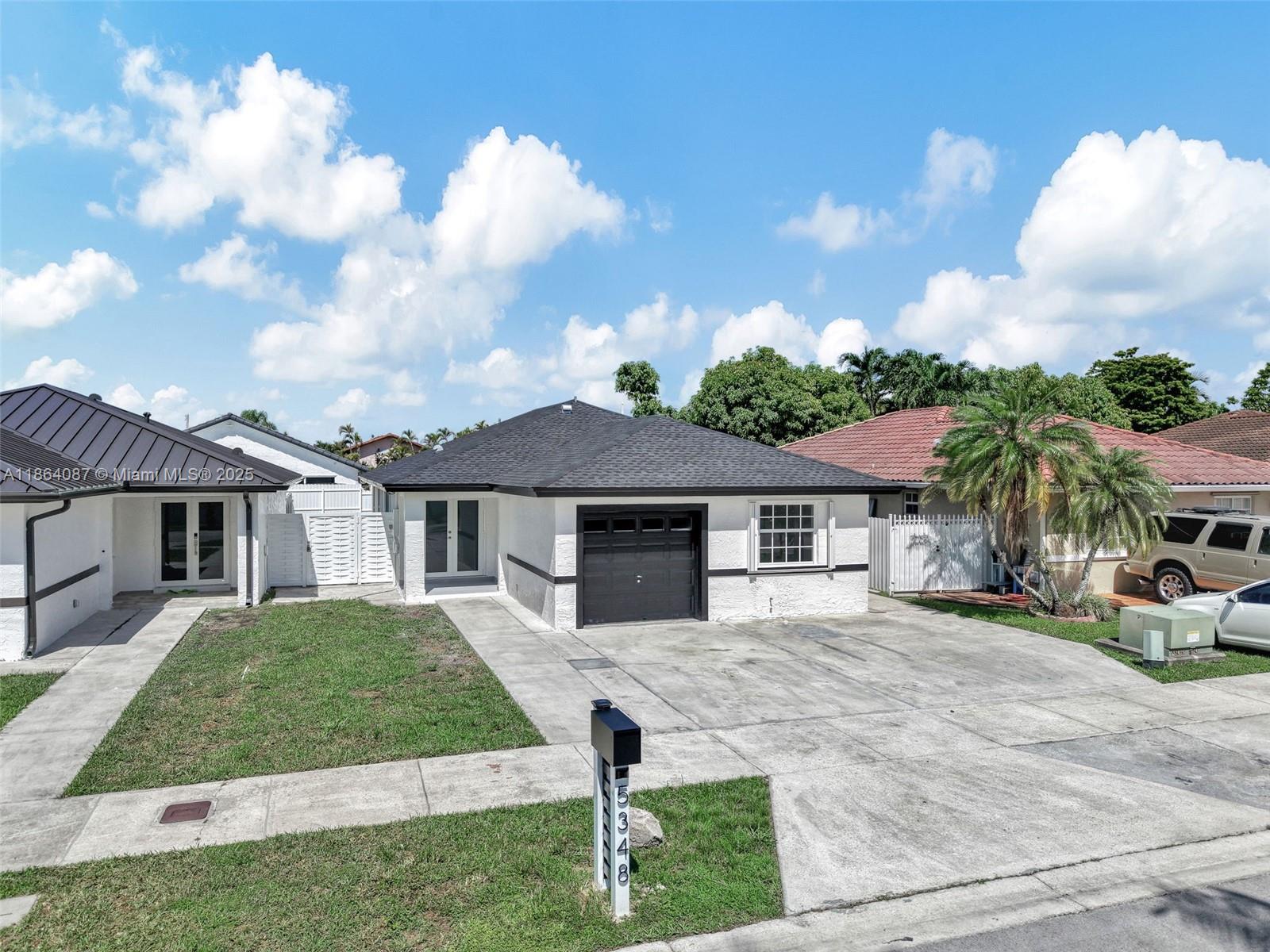 Location, Location! Beautiful 3/2 home with 1-car garage in prime SW Miami between Miller & Bird Rd near 137 Ave. Open concept layout with a stunning kitchen featuring Quartz countertops, large island with seating, and new stainless steel appliances. Spacious master suite with two walk-in closets and a luxury bath with dual shower heads, glass doors, and double vanity. Enjoy the big covered tiled terrace perfect for entertaining. Home includes a new roof with permits (2025), new backyard fence, and large driveway with plenty of parking. Move-in ready!