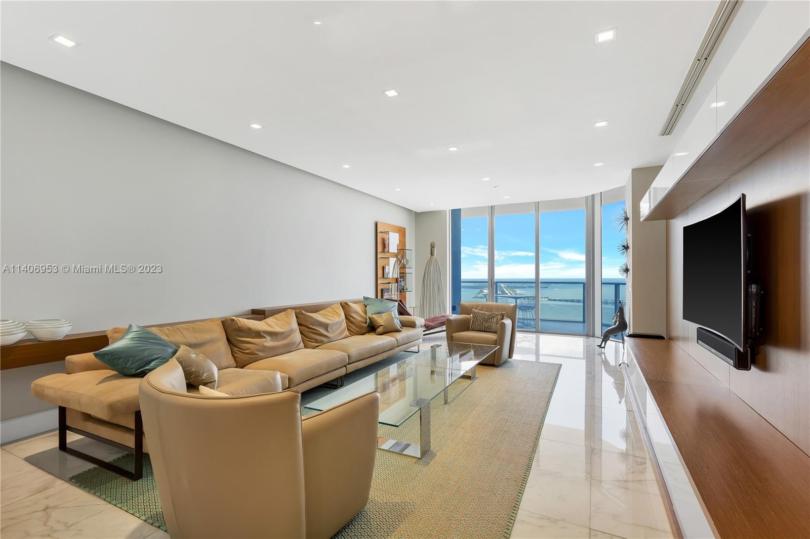 One of a kind stunning unit with an spectacular 360 degrees view to the city and the ocean. Complete remodeled unit with marble and parquet wood floor in bedrooms. 2625 sqft under AC plus 431 sqft of terraces. 3 complete bedrooms with their own bathroom. Half bath and laundry room. Unit has SONOS sound system incorporated in all areas. Complete home automation LUTRON brand with installed tablets (apple iPads). Led illumination in the entire apartment, electric shades and blackouts. the unit is sold furnished including more than 150K in art. A must see.