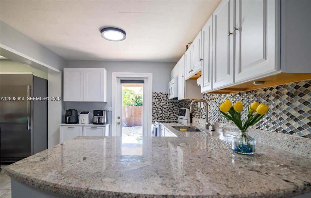 Photo of 2950 NE 11th Ave, Pompano Beach, FL 33064 (MLS # A12003649)