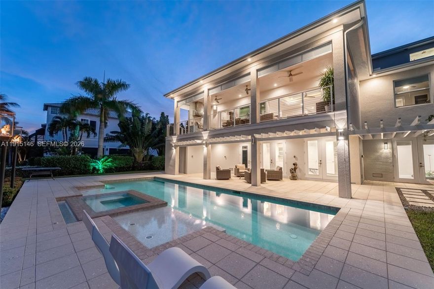 Welcome to Tidewater Island, Fort Myers’ exclusive gated community. This custom waterfront estate offers concrete construction, luxury finishes, and seamless indoor-outdoor living with a great room, lanai with outdoor kitchen, chef’s kitchen with walk-in pantry, room with bar and fireplace, and three-bedroom accommodations including a private primary suite with spa bath, custom dressing room, and balcony showcasing stunning sunset views over the estuary. The lower level adds a fitness room, additional guest suite, and heated saltwater pool surrounded by tropical landscaping. A private dock provides direct, bridge-free Gulf access. Features include full-home generator, impact windows and doors, elevator, water filtration system, three-car garages, and propane tank.