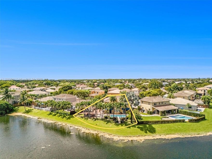Enjoy constant lakefront breezes from this corner-lot home with a resort-style backyard featuring a tiki hut& heated pool. The spacious kitchen and dining area seat up to 13, perfect for gatherings. Inside, you’ll find tile flooring throughout, a convenient downstairs bedroom and bath, plus a renovated hall bathroom.

Recent upgrades include a pool heater, whole-house water filtration/softening system, and modern finishes. A two-car garage and space for a boat or RV add extra convenience. Located in a quiet, well-kept community just minutes from the Turnpike and Black Point Marina.