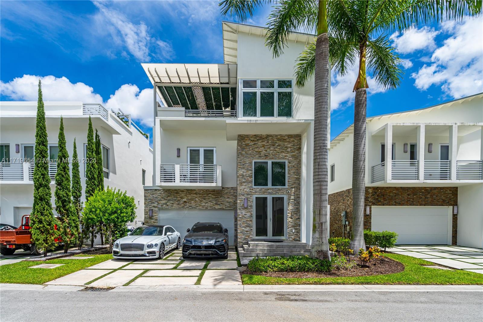 WELCOME TO THIS EXQUISITE 3-STORY MODERN OASIS LOCATED IN THE HEART OF DORAL, WHERE LUXURY MEETS COMFORT. THIS HOME FEATURES A SLEEK POOL TERRACE FOR ULTIMATE RELAXATION, A SOPHISTICATED WALK-IN WINE CELLAR FOR THE WINE ENTHUSIAST, AND FULLY BUILT-OUT CLOSETS FOR EFFORTLESS ORGANIZATION. THE INTERIORS BOAST ELEGANT MARBLE FLOORING THROUGHOUT, WITH WATERPROOF VINYL ON THE STAIRS AND UPSTAIRS AREAS FOR STYLE AND DURABILITY. THE ROOFTOP IS A TRUE ENTERTAINER’S PARADISE, EQUIPPED WITH A BUILT-IN BBQ, AN AWNING FOR SHADE, AND AMPLE SPACE TO HOST UNFORGETTABLE FAMILY GATHERINGS OR LIVELY CELEBRATIONS WITH FRIENDS. WHETHER YOU’RE ENJOYING QUIET EVENINGS OR LIVELY EVENTS, THIS HOME OFFERS IT ALL. DON’T WAIT—MAKE THIS CONTEMPORARY MASTERPIECE YOUR DREAM HOME TODAY!