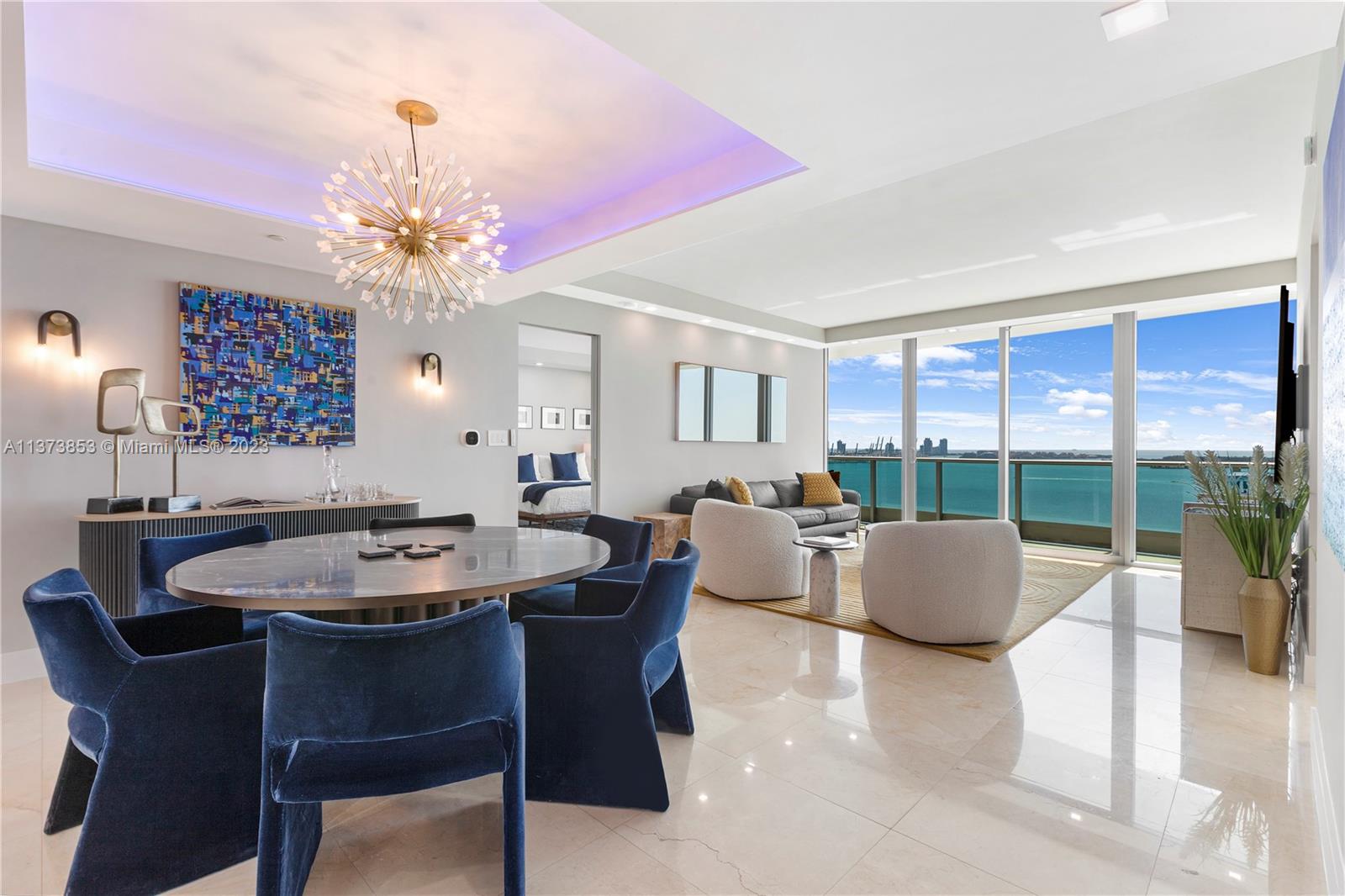 This designer residence at Jade Brickell offers stunning water views & features a newly opened kitchen w/custom solid wood cabinetry, gold-tinted glass doors, Calacatta Marble counters & new appliances. The 2 ensuite bedrooms have custom-built closets, & there's a den w/a full bath that serves as a guest room/office. All 3 baths have been renovated & the primary has a state-of-the-art Steamist shower. Addt’l features: Lutron lighting system, ecobee Smart Thermostat, power blackout shades, RHEEM high capacity water heater, & new a/c system. Enjoy the tranquility of living by the water & the convenience of city living just steps away: great restaurants, shopping, & entertainment. The location is also within a short drive to the beach, the Design District, Wynwood, & International airports.