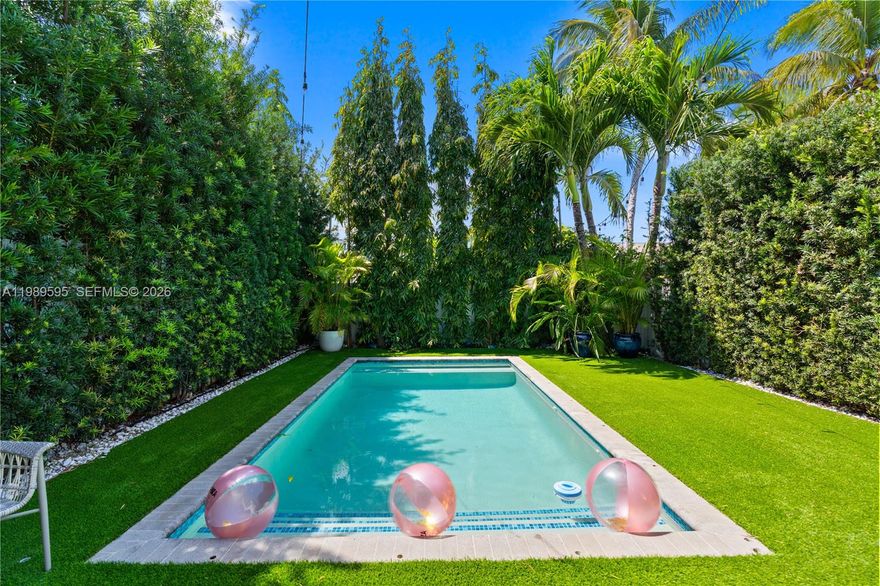 Experience modern living in this gated townhouse with a private pool and lush tropical garden, beautifully blending indoor and outdoor living. Featuring an open-concept layout, this home is thoughtfully designed for relaxed everyday living and effortless entertaining. Upstairs, you’ll find 4 spacious bedrooms. The expansive primary suite features a private balcony, a generous walk-in closet, and a spa-like bathroom. Three additional bedrooms, including one with its own private terrace, and two bathrooms complete the second floor. Custom window treatments and tasteful upgrades can be found throughout the home. The property also includes a 1-car garage plus driveway space for 1 additional car, equipped for EV charging. Ideally located at the crossroads of North Grove, Shenandoah, and The Roads, this home is just steps from the brand new Woodside Park and The Underline. Enjoy easy access to I-95 and be just minutes from trendy restaurants, shops, and parks.