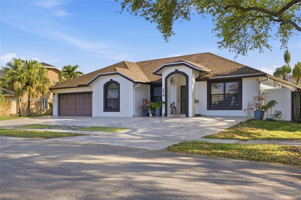 Photo of 1010 SW 149th Ln, Sunrise, FL 33326 (MLS # A11989016)