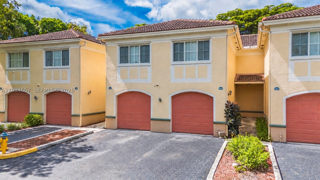 Photo of 2474 Centergate Dr #203, Miramar, FL 33025 (MLS # A12084657)