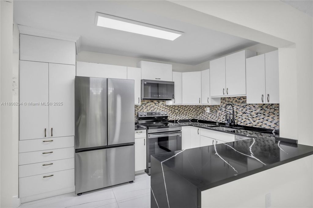 Photo of 4154 NW 90th Ave #104, Coral Springs, FL 33065 (MLS # A11806294)