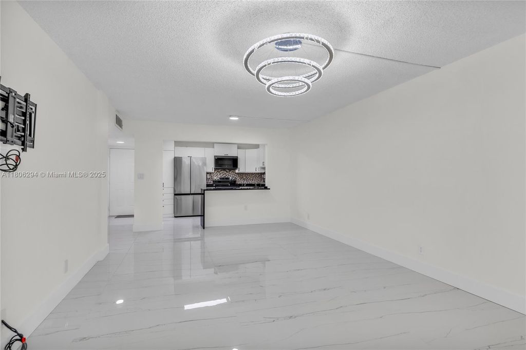 Photo of 4154 NW 90th Ave #104, Coral Springs, FL 33065 (MLS # A11806294)