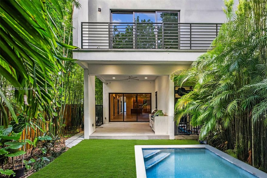 Experience the best of Coconut Grove living in this modern 4-bedroom, 5-bath single-family home, built in 2022 for effortless indoor-outdoor living. Behind a private gate, it offers open spaces, floor-to-ceiling impact glass, and refined finishes throughout. The gourmet kitchen features Italian Pedini cabinetry, Bosch appliances, and quartz countertops. The layout includes a floating staircase, sleek baths, and two A/C units. Step outside to a private pool, summer kitchen, and lush landscaping. Ideally located on a quiet tree-lined street near top schools, parks, restaurants, and marinas. Two-car garage and smart-home features complete this home.