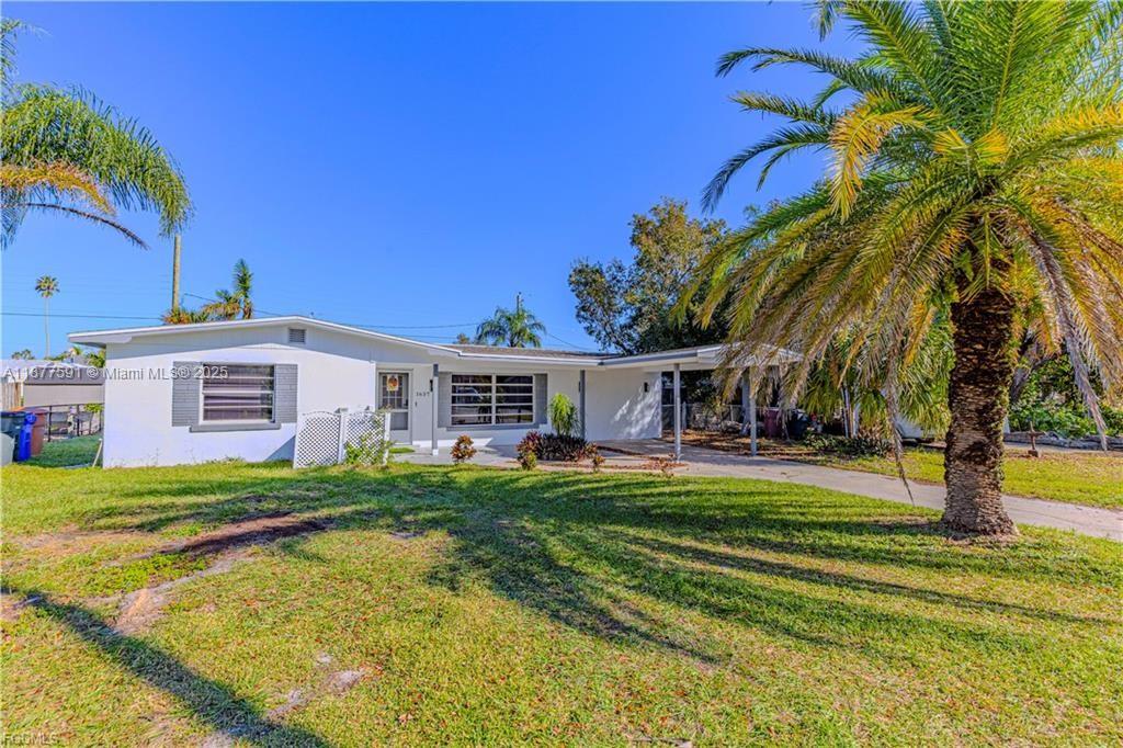 This gorgeous 4 bedroom, 2 bath pool home in the historic Palm Lee Park community combines timeless charm with modern updates. This property is NOT IN A FLOOD ZONE. Inside, the home feels bright and open, showcasing a sleek new kitchen with stainless steel appliances, large tile floors, and trendy finishes throughout. Both bathrooms have been tastefully renovated, and a new roof provides peace of mind. Step out to the screened lanai with sparkling pool, perfect for relaxing or entertaining. Ideally located near Jefferson Park, Ft. Myers Country Club golf, and the shopping and dining of Downtown Ft. Myers, this home offers style, comfort, and convenience all in one.