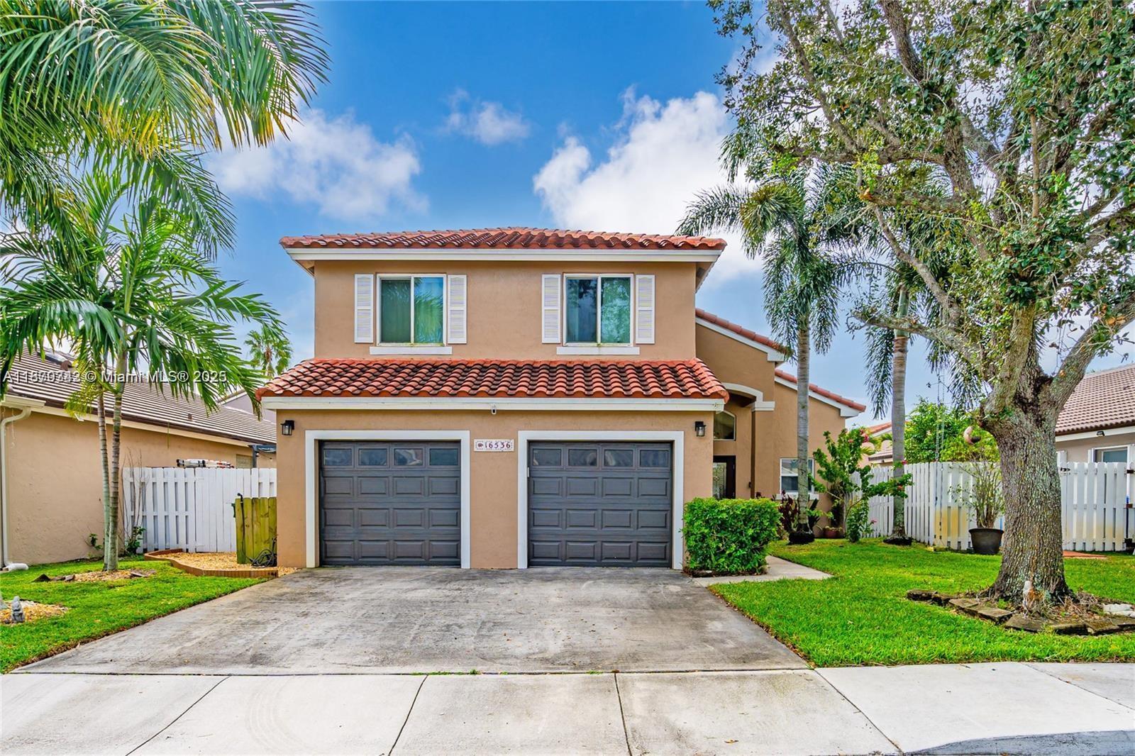 Beautiful 4-bedroom, 2.5-bath, two-story home located in the heart of Pembroke Pines. Features spacious living and dining areas, ideal for both everyday living and entertaining. Enjoy the peace of mind that comes with impact doors and windows throughout. Private backyard retreat, complete with a covered sitting area and built-in grilling space—perfect for summer gatherings. . Roof replaced in 2020 and a security camera system for enhanced safety. Conveniently situated near highways, supermarkets, shopping center, and A-rated schools, this home effortlessly blends modern convenience with outdoor charm. Don’t miss the opportunity to make this Pembroke Pines gem your new home!