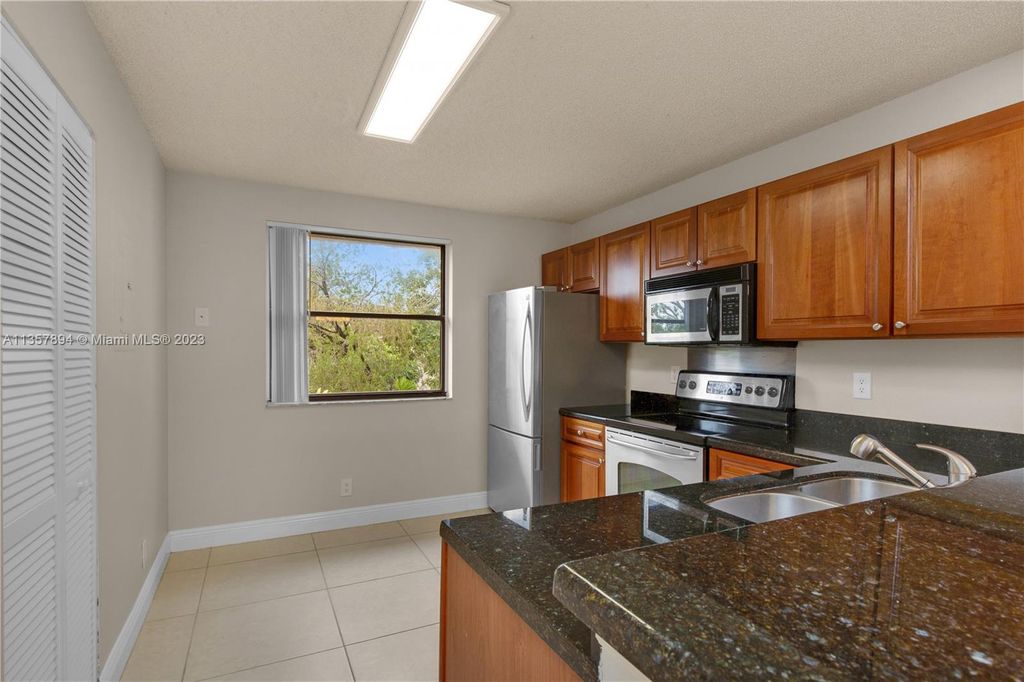 Photo of 10105 W Sunrise Blvd #306, Plantation, FL 33322 (MLS # A11357894)