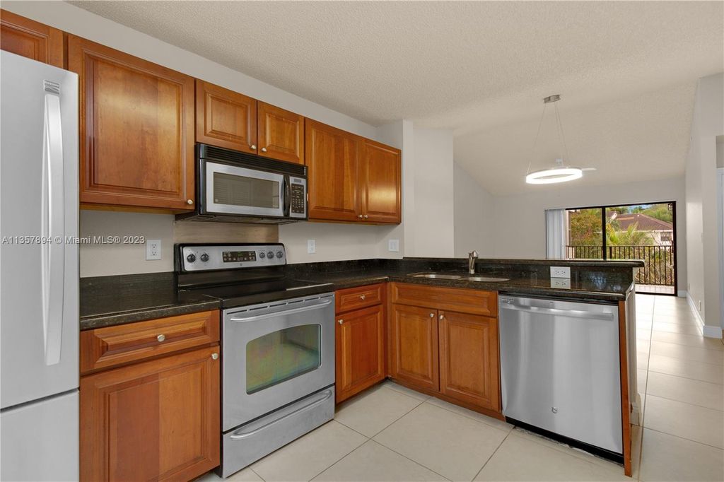 Photo of 10105 W Sunrise Blvd #306, Plantation, FL 33322 (MLS # A11357894)